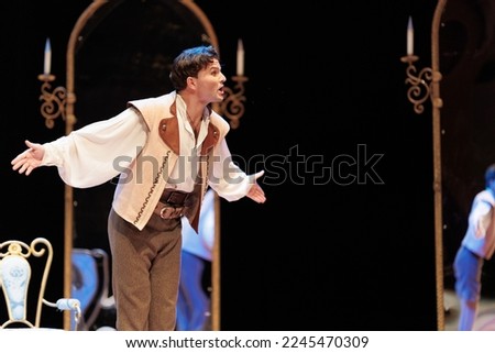 Actor men in old clothes play on stage theater