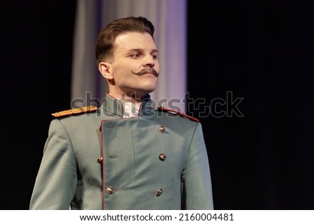 Actor men in old clothes uniforms play on stage theater