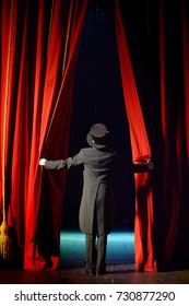 The Actor Opens A Theater Curtain