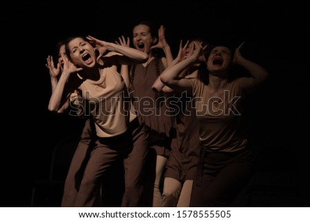 Actors and actresses play a modern lyrical performance of the show on the stage of the theater