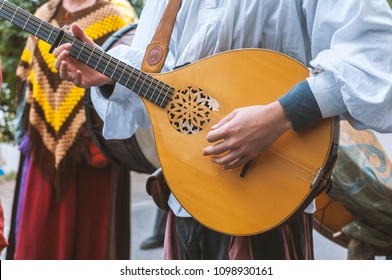 Actors playing musical instrument mandolin in the street