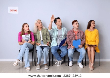 Actors waiting for casting in hall