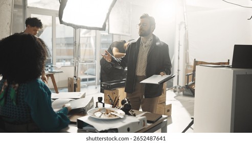 Actress, conversation and director with script in studio for feedback or instructions on film process. Discussion, production or videography with producer and talent on set for shoot direction