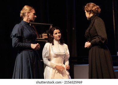 Actress Women In Vintage Black Dresses With Long Skirts Play On Stage Theater