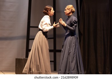 Actress women in vintage dresses with long skirts play on stage drama theater