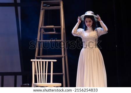 Actress women in vintage dresses with long skirts play on stage theater