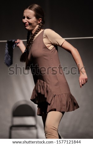 Actress young woman plays modern lyrical performance show on the stage of the theater