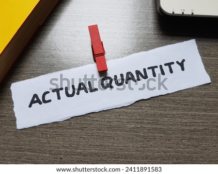 Actual quantity writting on table background.