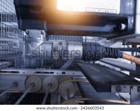 Actuator pneumatic system on the Automatic eggs candling machine.Hatchery technology.