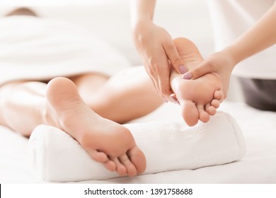 Acupressure And Reflexology Concept. Foot Massager Oppresses Energy Flow Points