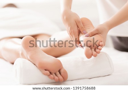 Acupressure And Reflexology Concept. Foot Massager Oppresses Energy Flow Points