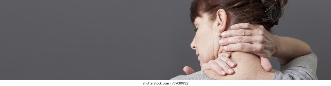 acupressure for relaxing shoulder and backache for middle aged woman, grey long banner