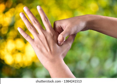 Acupressure, Self Medication Concept In Outdoor Sunlight