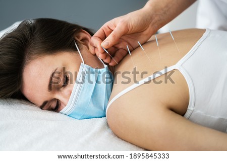 Acupuncture Massage Therapy Treatment In Face Mask
