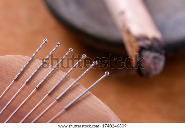 Acupuncture needle and moxa\
stick