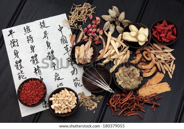 Acupuncture needles with chinese\
herbal plant medicine selection with calligraphy\
script.