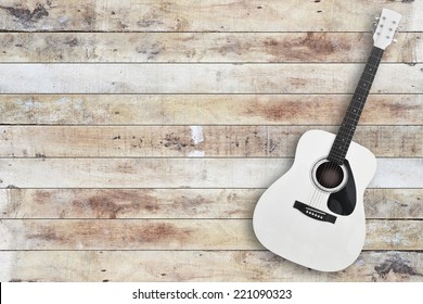 Acustic Guitar On Wooden Floor Background