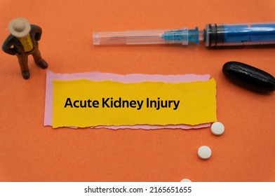 Acute Kidney Injury.The Word Is Written On A Slip Of Colored Paper. Health Terms, Health Care Words, Medical Terminology. Wellness Buzzwords. Disease Acronyms.