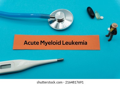 Acute Myeloid Leukemia.The Word Is Written On A Slip Of Colored Paper. Health Terms, Health Care Words, Medical Terminology. Wellness Buzzwords. Disease Acronyms.