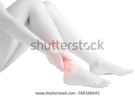 Acute pain in a woman  ankle isolated on white background. Clipping path on white background