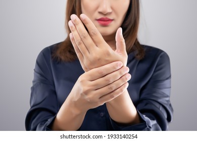 Acute pain in a women wrist. Women suffering from hand pain.
