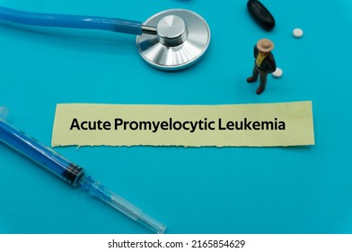 Acute Promyelocytic Leukemia.The Word Is Written On A Slip Of Colored Paper. Health Terms, Health Care Words, Medical Terminology. Wellness Buzzwords. Disease Acronyms.