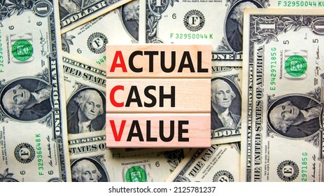 ACV actual cash value symbol. Concept words ACV actual cash value on wooden blocks on a beautiful background from dollar bills. Business and ACV actual cash value concept. Copy space. - Shutterstock ID 2125781237