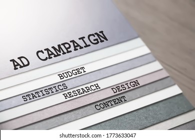 Ad Campaign budget design content research statistics. words on pages. Business advertising marketing concept.