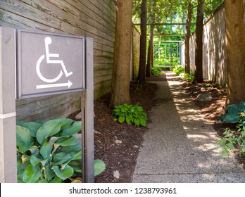 ADA Compliant Handicap Disability Signs With Symbol In Park For Accessibility And Compliance