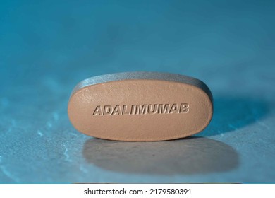 Adalimumab Drug Pill Medication ob Blue Background