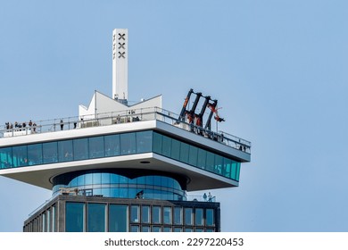 A'dam building in Amsterdam with the lookout tower, revolving restaurant and swim.  Dutch attraction for tourism and views in gorgeous sunshine with blue sky