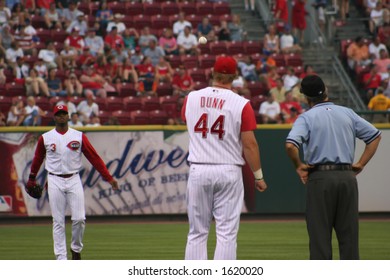 Adam Dunn And Ken Griffey Jr Playing Catch Before A Game