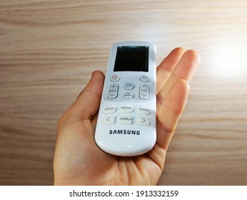 ADANA,TURKEY-FEBRUARY 03 2021:samsung air conditioner remote in a man's hand - Shutterstock ID 1913332159