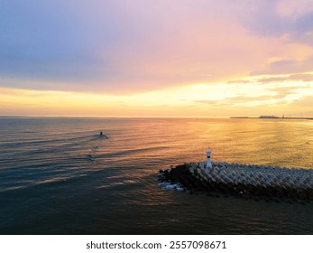 ADAPAZARI Scenic Coastal Sunset with Lighthouse and Calm Waters. Breathtaking sunset over a calm coastal waterway, featuring a small lighthouse and breakwater. Karasu Holiday City and Holiday Center.  - Powered by Shutterstock