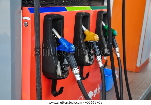 Add fuel oil to the car in the fuel pump with a\
dispenser.(select focus)
