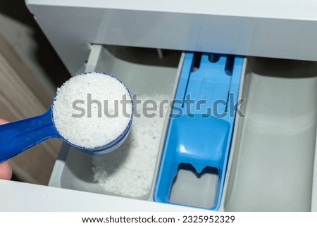 Add the powder to a special compartment in the washing machine