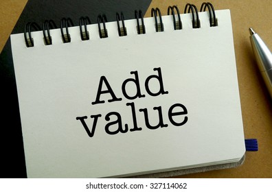 Add Value Memo Written On A Notebook With Pen