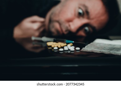Addict, breaking, pain, depression, illness. Drug addict look dependent on different types of drugs. Drugs concept.Toned selective focus.