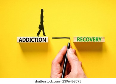 Addiction recovery symbol. Concept words Addiction recovery on beautiful wooden blocks. Psychologist icon. Beautiful yellow table yellow background. Psychology addiction recovery concept. Copy space.