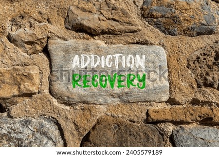 Addiction recovery symbol. Concept words Addiction recovery on beautiful grey stone. Beautiful brown stone wall background. Psychology addiction recovery concept. Copy space.