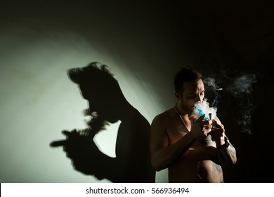 Addictive Man Smoking Marijuana Bong