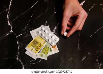 Addict's Hand With Money Buying A Dose Of Cocaine, Heroin Or Other Drug From A Drug Dealer. Drug Abuse And Traffic Concept.