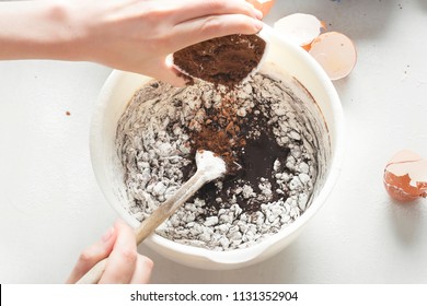 Adding Cocoa Powder To Chocolate Brownie Batter 