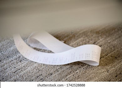 Adding Machine Paper Tape Gathered On Carpeted Floor