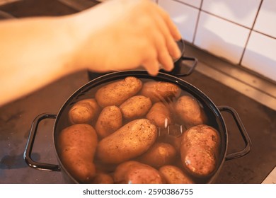 Adding Salt to Boiling Potatoes on Stovetop