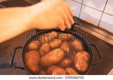Adding Salt to Boiling Potatoes on Stovetop