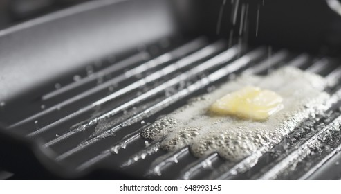 Adding Salt On Grill Pan With Melting Butter, Wide Photo