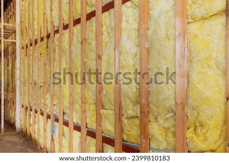 Adding thermal insulation to wall using mineral rock wool during new construction