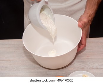 Adding Yogurt Into Bowl. Making Yogurt Cake.