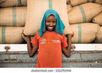 Addis Ababa, Ethiopia - January 30 2014: Men stacking large bags of coffee beans in a warehouse